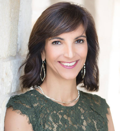 Austin, TX oculoplastic facial surgeon, Dr. Malena Amato, in a green blouse