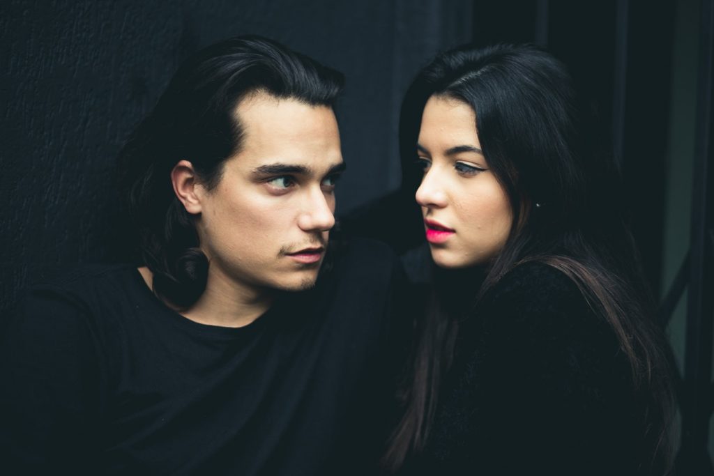 man and woman facing each other